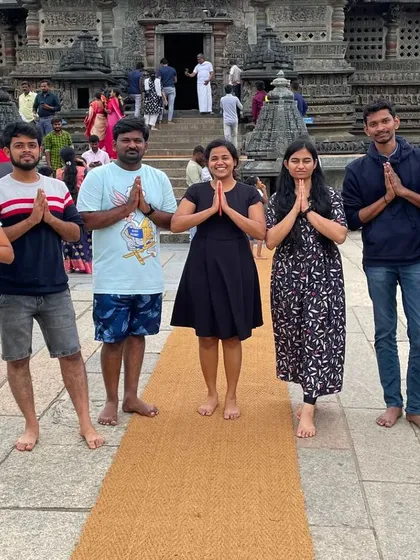 A moment of peace and respect at the Belur temple with some of the group members.