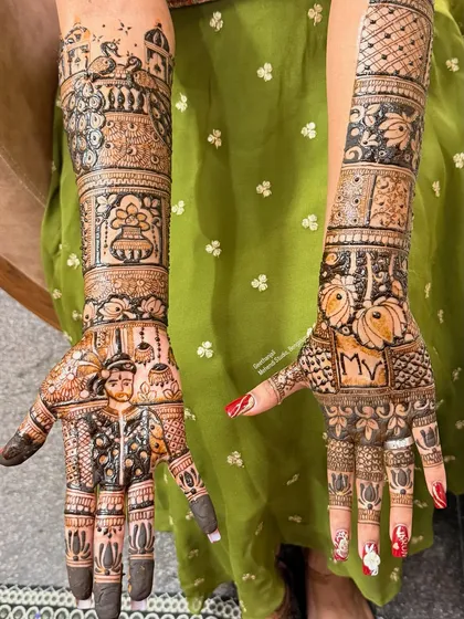 A complete bridal story on both hands. This design features a portrait of the groom on one palm and the couple's initials on the other, surrounded by traditional motifs like peacocks and a kalash.