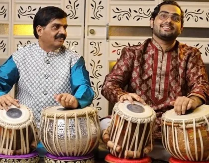 This is a cherished moment with my appa and guru, Pandit Rajgopal Kallurkar. Learning from him is the greatest blessing, as this art is a legacy passed down through my family. We are seen here in a tabla duet setting.