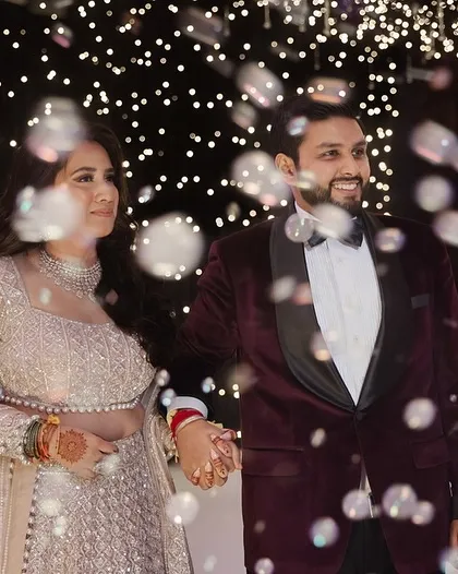 Another shot of the couple's bubble-filled Sangeet entrance, capturing their happy expressions.