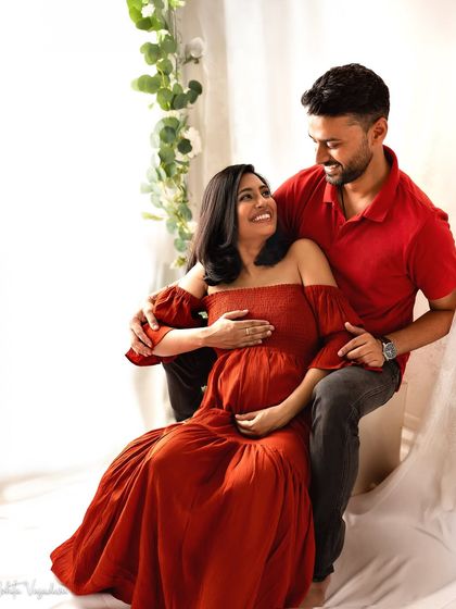 The look of pure adoration. This bright, happy portrait captures the love and excitement of the dad-to-be.