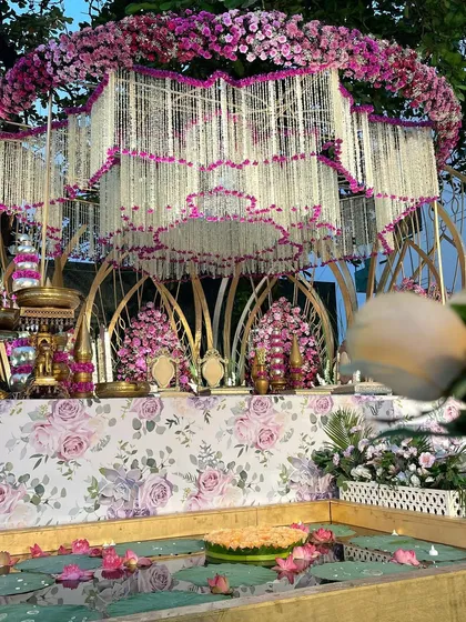 A close-up of the signature Lotus Mandap, showing the intricate details of the floral canopy. The design is inspired by the blooming lotus, symbolizing purity and beauty.