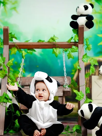 This little panda reaches out, inviting you to join the fun in his bamboo playground.
