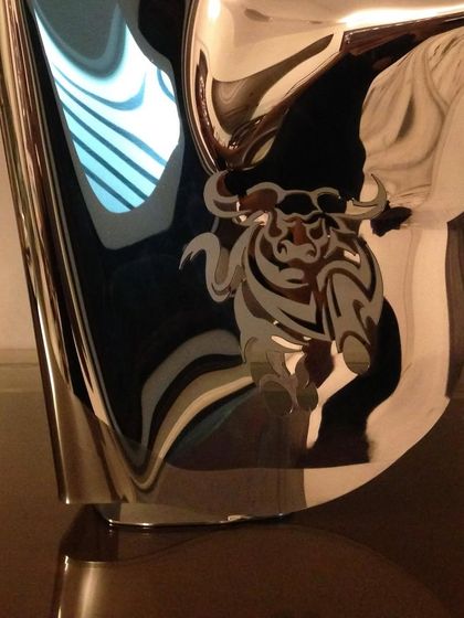 "Bull Series I," a freestanding piece where the bull engraving seems to charge across the polished steel surface.