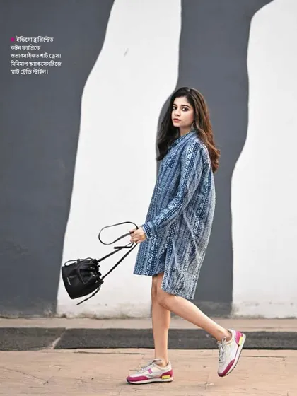 A full-page spread in Sananda magazine featuring a model in a contemporary printed dress. The image is used to illustrate a modern fashion trend, showcasing my work in a published context.