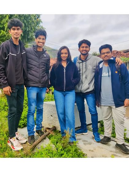 Posing for a photo during our Achalu Betta trek. The scenery on the way up is just as beautiful as the summit.