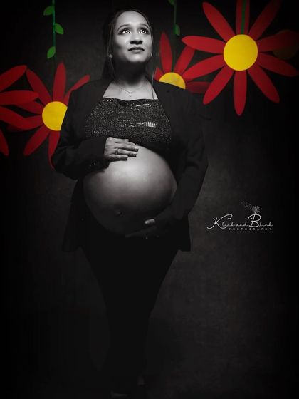 A powerful and moody monochrome portrait. Using a simple blazer and dramatic lighting, we created a shot that emphasizes strength, confidence, and the beauty of the baby bump.