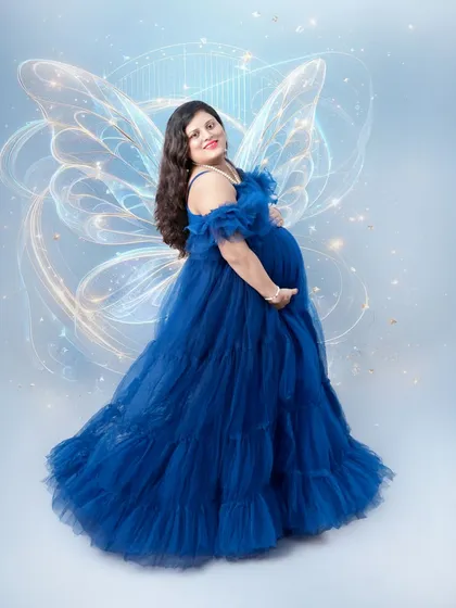 Celebrating the magic of motherhood. For this maternity shoot, we added ethereal fairy wings to a beautiful flowing gown, transforming a simple portrait into a fantasy. I love working with moms-to-be to create images that reflect their inner glow.