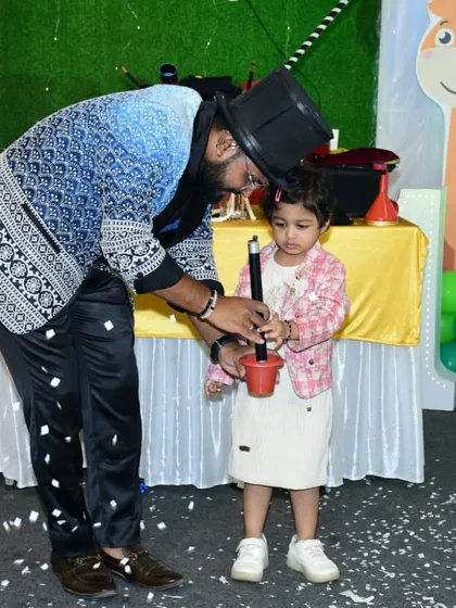 This little girl is learning how to use a magic wand for the first time. My goal is to inspire wonder and create a fun, memorable experience for the youngest members of the audience.