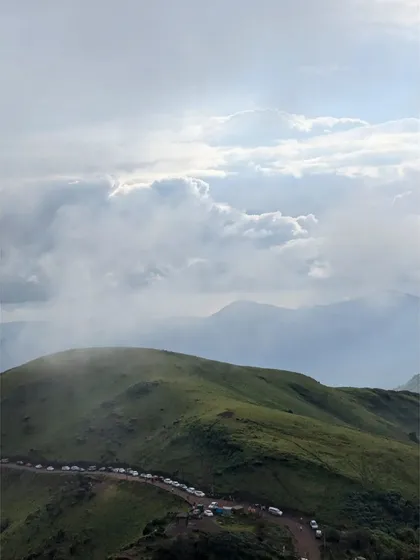 The stunning green hills of Chikmagalur shrouded in mist. This is the kind of view that makes you forget all about city life.