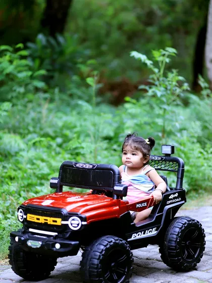 A full view of Vaanya enjoying her ride during our outdoor toddler photography session. Capturing kids interacting with props creates authentic and playful images that tell a story about their personality at this age.
