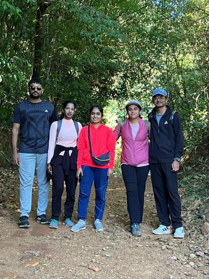 A group photo inside the shaded forest section of the Kurinjal trek.