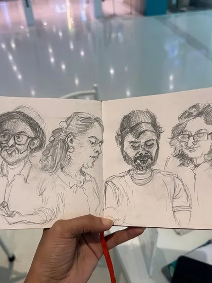 A sketchbook spread filled with pencil caricatures of my fellow artists. Sketching my friends during our meet-ups is one of my favourite ways to practice and capture their personalities.