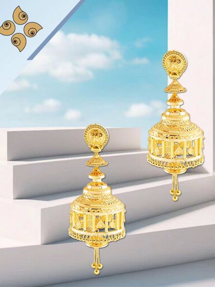 Exquisite gold jhumkis with a multi-tiered, caged design. These statement earrings are crafted to be lightweight yet grand, making them a popular choice for festive occasions.