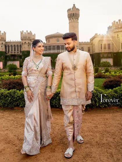 Creating coordinated outfits for couples is one of my greatest joys. This stunning pair is dressed in complementary pastel ensembles, with the bride in a hand-embroidered saree and the groom in a matching silk kurta set, perfect for their pre-wedding photoshoot.