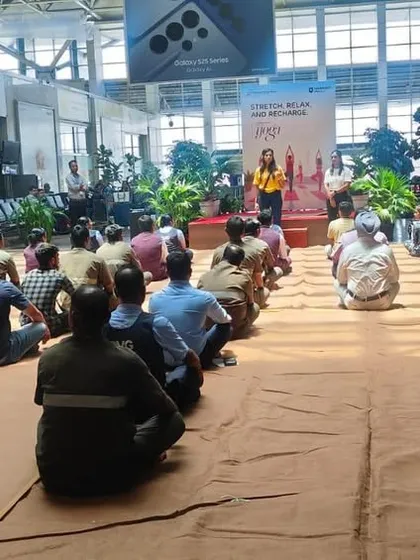 A wide view of a yoga session for staff at Mumbai Airport. Bringing moments of calm to high-stress environments is a key part of my corporate wellness philosophy.
