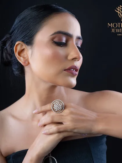 A classic round cluster ring, elevated by its impressive size and the sheer number of pave-set diamonds. A timeless piece for any fine jewellery collection.