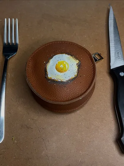 Sometimes the quirkiest ideas are the most fun. I turned this simple brown leather pouch into a hyper-realistic fried egg. It’s a perfect example of how we can add a bit of unexpected joy to an everyday item.