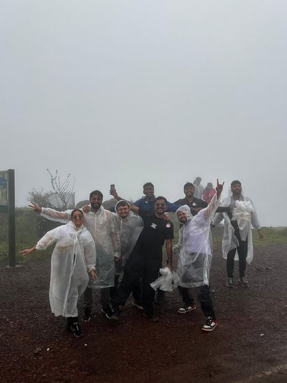 A group of friends having fun on the misty trails of Kodachadri.