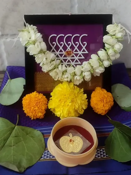 A client shared this beautiful photo of their Dussehra puja, featuring my mini Saraswati frame adorned with a jasmine garland.