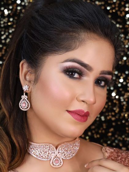 A delicate rose gold choker with pink stones. This is a perfect, lightweight option for a party or a bridesmaid's outfit.