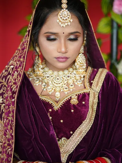 A close up shot focusing on the eye makeup. The blended eyeshadow and defined liner create a captivating look, perfect for a bride who wants to make a statement.