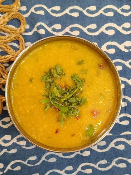 A close-up of my simple and comforting yellow dal, garnished with fresh coriander.