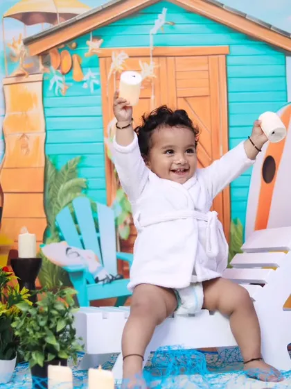 A moment of pure joy from our beach-themed photoshoot. This little one is having a blast.