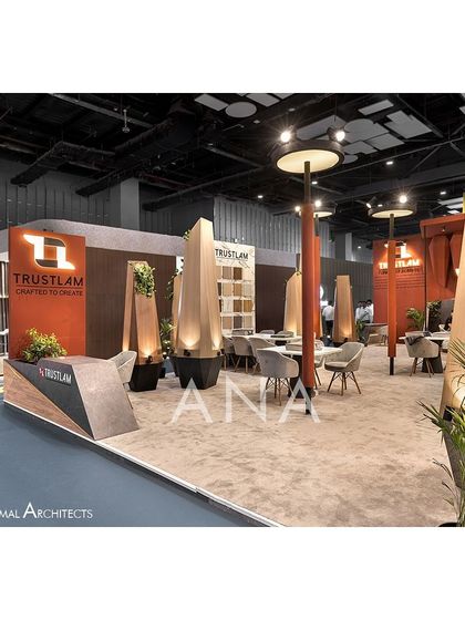 An interior view of the Trustlam '23 stall, where the flame-like sculptures are interspersed with seating areas. This created a unique, park-like atmosphere for client meetings.