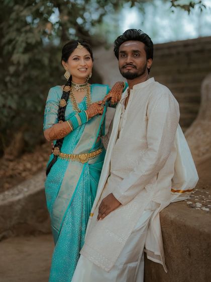 A stylish couple portrait. The bride looks confident and beautiful in her traditional South Indian attire.