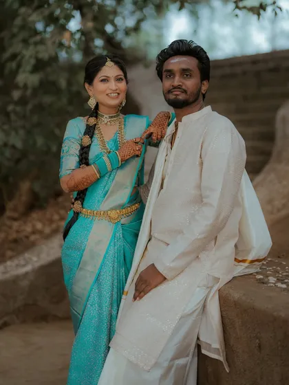 A stylish pose from the couple. The bride's confidence and the groom's relaxed demeanor make for a great shot.