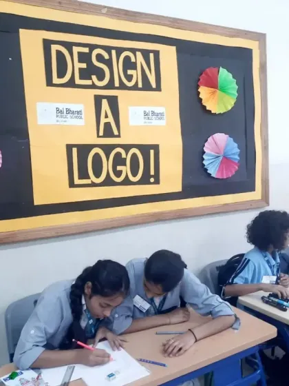 Students hard at work during the "Design a Logo" competition. It was a joy to watch their creative process unfold.