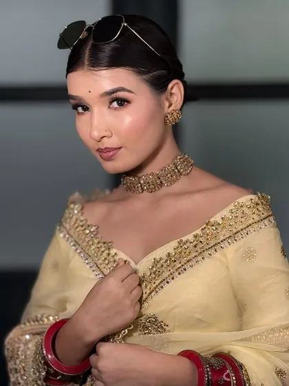 Another angle of the modern, chic look with the yellow saree. This is great inspiration for a pre-wedding shoot.