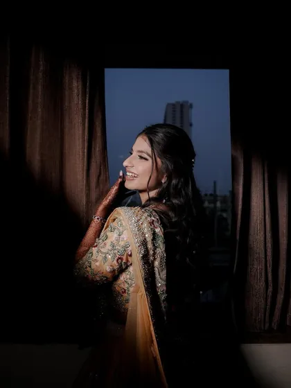 A beautifully lit portrait of an engagement bride. Her makeup features a soft glam eye and glowing skin, designed to catch the light perfectly and create a dreamy, ethereal effect.