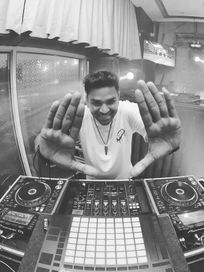 A fun, wide-angle shot from behind the decks. My goal is always to make the experience interactive and engaging for everyone.