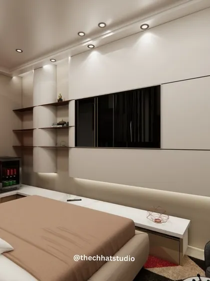 Smart storage and integrated amenities are key to a great hotel stay. This view shows the custom-built media wall with integrated shelving, a concealed mini-fridge, and soft backlighting, combining functionality with a clean, modern aesthetic.