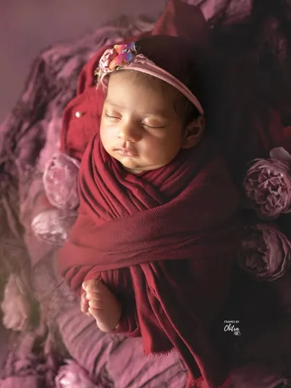 A dreamy, soft-focus shot that gives this plum-themed portrait an ethereal and artistic quality.