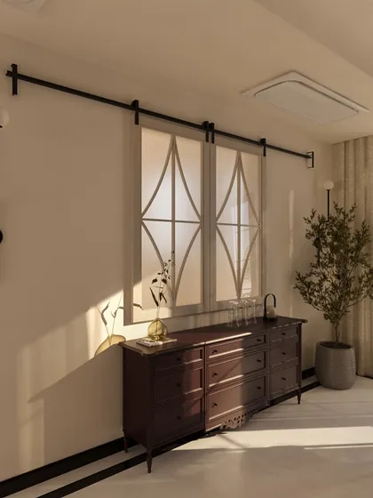 Here, sliding panels with a delicate geometric pattern serve as an elegant screen, adding a layer of visual interest and texture. This detail complements the room's neoclassical language while providing a modern, functional element.