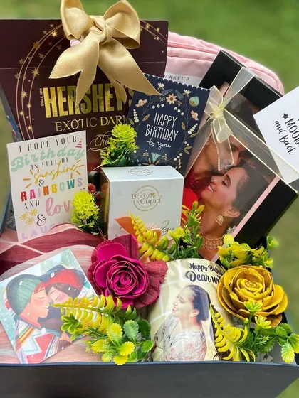 We created this luxurious birthday hamper for a client's wife, and it’s filled with personal touches. It includes a custom photo mug, a stylish scarf, premium Hershey's dark chocolate, Body Cupid perfume, and multiple heartfelt birthday cards, all arranged beautifully in a keepsake box.