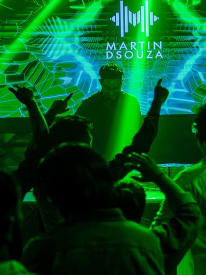 A silhouette shot of me against a green graphic display.