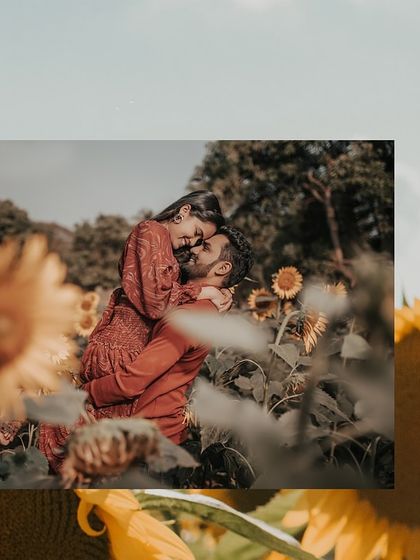 A romantic embrace amidst sunflowers, this shot captures the intimacy and warmth of the couple's connection.