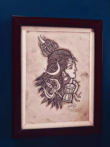 A profile drawing of Lord Shiva, incorporating zentangle patterns into his hair and ornaments. This A4 piece comes in a brown frame.
