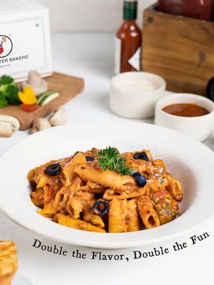 Another look at our Mixed Sauce Pasta, served with a side of toasted garlic bread. It's a comforting and flavorful dish that satisfies every pasta craving.