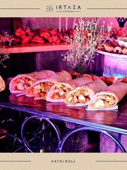 Hearty and flavorful Kathi Rolls, filled with spiced chicken and vegetables. These are a great substantial snack for any party.