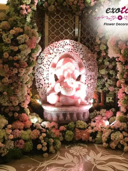 For us, Ganpati decorations are an act of devotion. This elegant pastel pink floral arrangement creates a serene and beautiful sanctuary for Bappa, combining modern aesthetics with traditional reverence in your home.