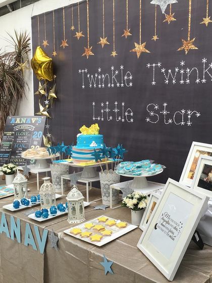 A "Twinkle Twinkle Little Star" dessert table for a first birthday. The chalkboard backdrop and star-shaped treats created a sweet and dreamy theme.