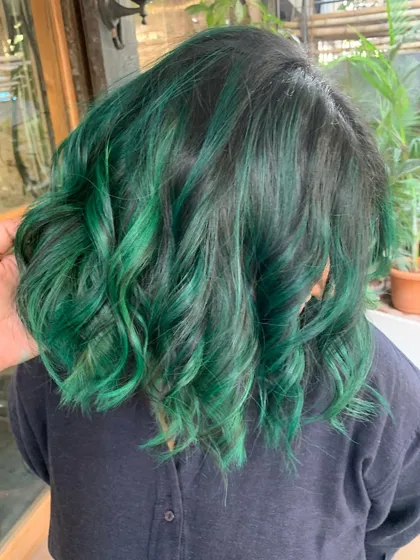The back of the emerald green hair. The color is rich and deep, with a beautiful shine.