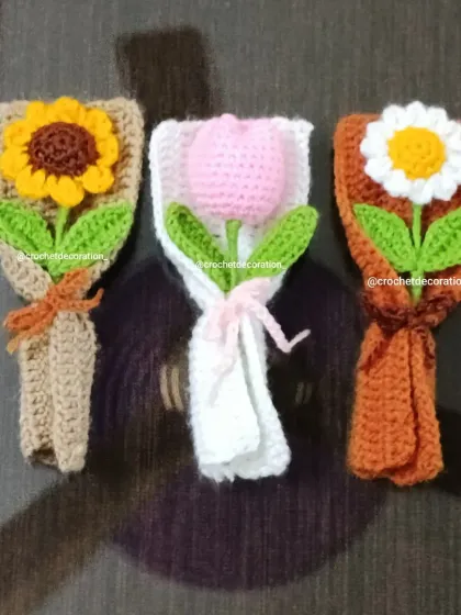 A top-down view of the three mini bouquets, showing the detailed wrapping on each one.