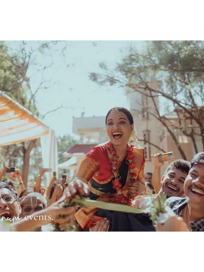 The bride's joyful Kasi Yatra, a fun and important ritual in Tamil weddings, celebrated by all the guests in this lively backyard setting.