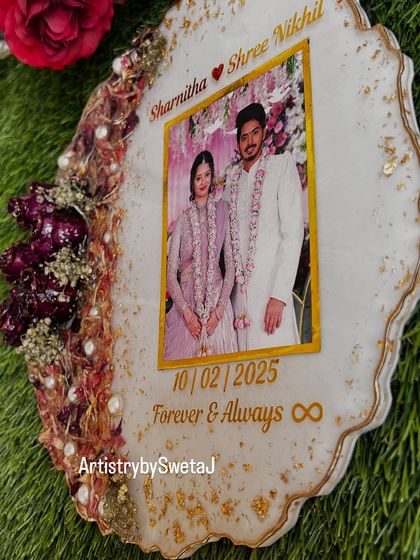 A side view of the varmala frame, showing the delicate geode edge and the careful placement of each preserved flower. Every angle is designed to be beautiful.